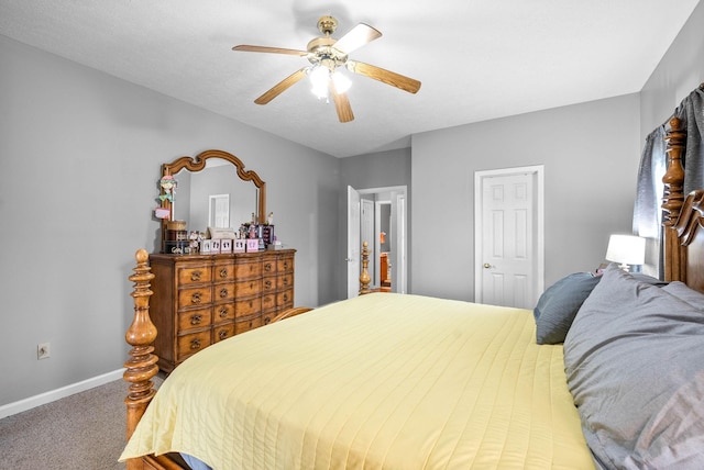 carpeted bedroom featuring ceiling fan and baseboards