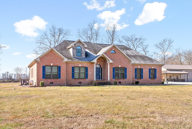 view of front of property with brick siding, crawl space, and a front yard