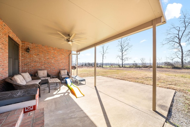 view of patio / terrace featuring a ceiling fan and an outdoor living space