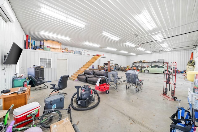 garage featuring metal wall and an AC wall unit