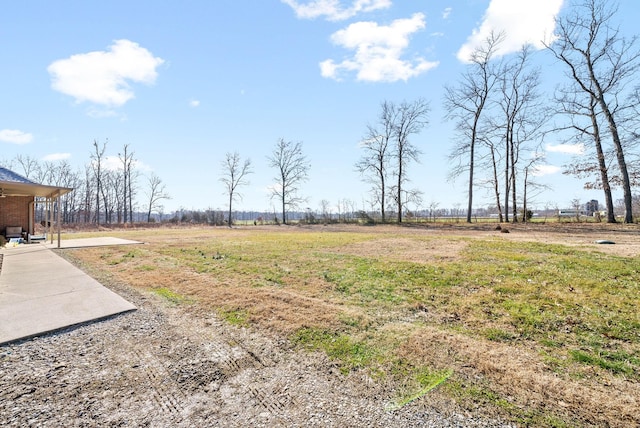 view of yard with a rural view