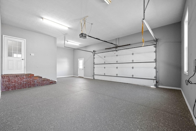 garage featuring baseboards and a garage door opener