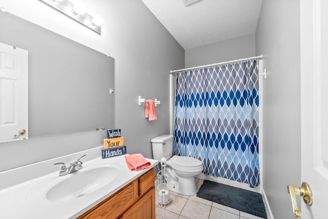 bathroom with toilet, curtained shower, vanity, and tile patterned floors