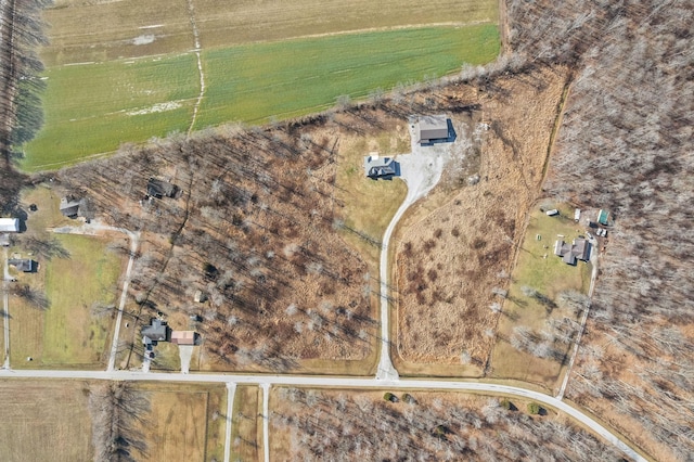 birds eye view of property with a rural view