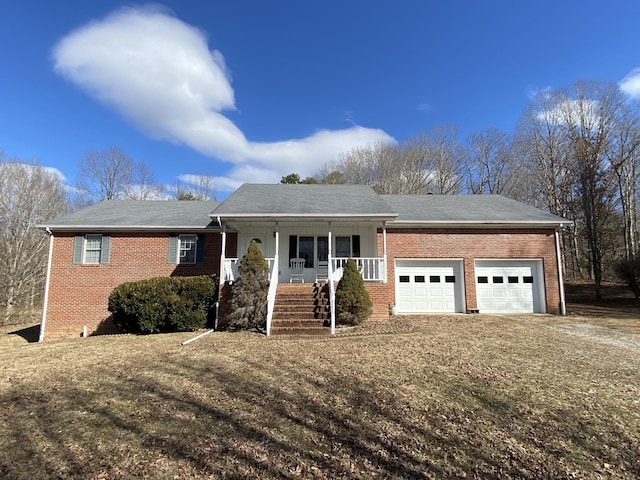 ranch-style home featuring driveway, a porch, an attached garage, and brick siding