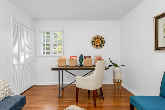 home office featuring wood finished floors and baseboards