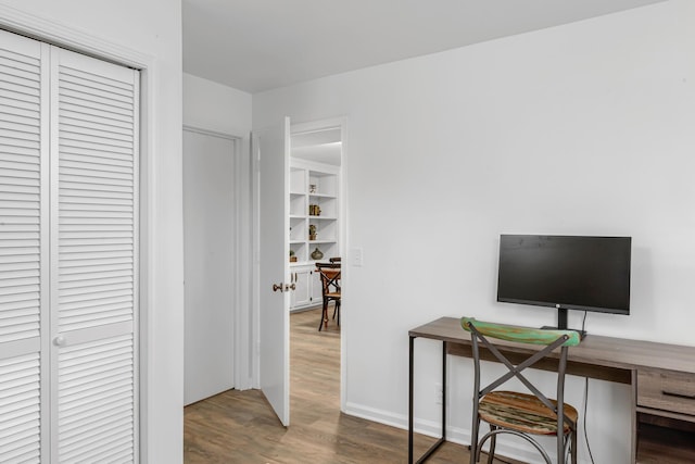 home office with wood finished floors