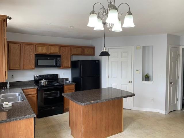 kitchen with brown cabinetry, dark countertops, a center island, black appliances, and pendant lighting