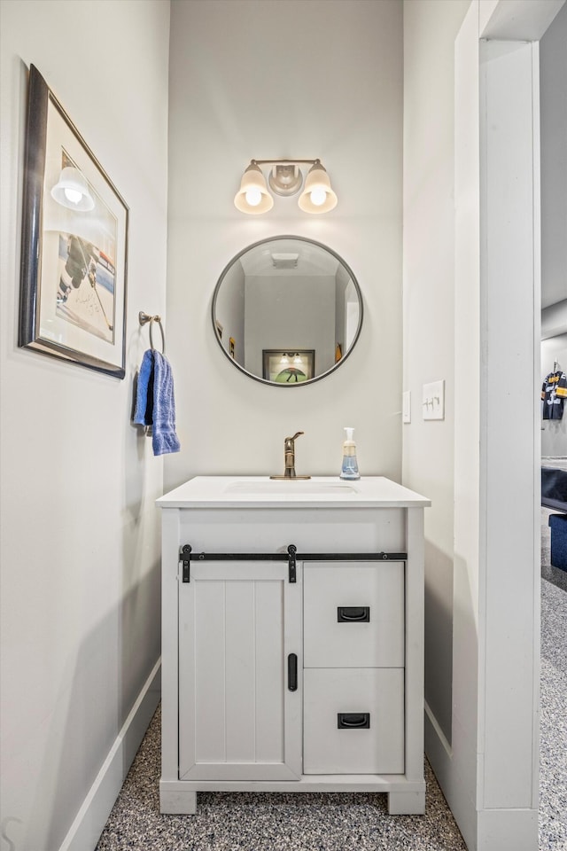 bathroom with baseboards and vanity