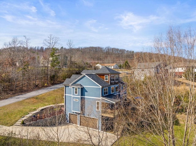 exterior space featuring driveway and an attached garage