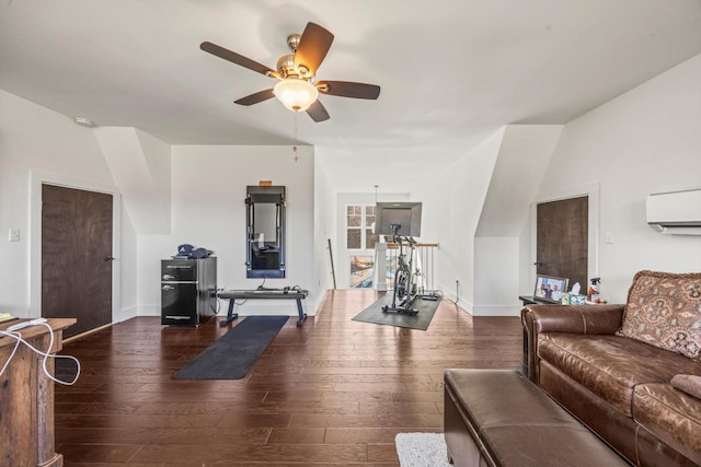 interior space featuring baseboards, a ceiling fan, dark wood-style flooring, and a wall mounted air conditioner