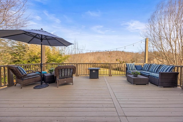 wooden terrace featuring an outdoor hangout area