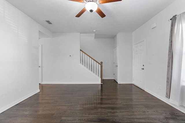 interior space with stairs, dark wood finished floors, and baseboards