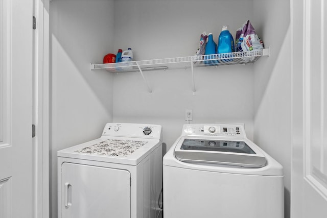 laundry room featuring laundry area and washing machine and clothes dryer