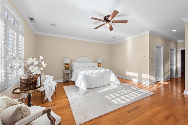 505 Wilcox St, Clarksville, TN 37040 - bedroom featuring visible vents, baseboards, a ceiling fan, ornamental molding, and light wood-style floors
