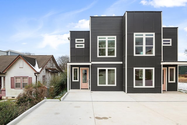 modern home featuring board and batten siding