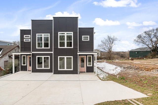 contemporary house with board and batten siding