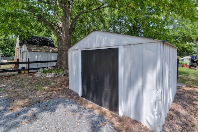 view of shed with fence