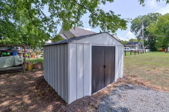 view of shed with fence