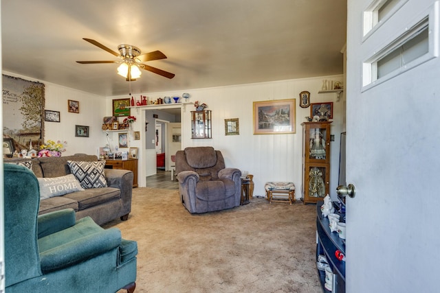 living room featuring carpet and ceiling fan