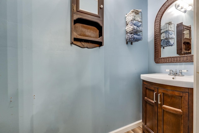 bathroom with baseboards and vanity