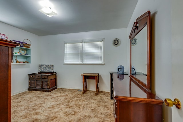 interior space with carpet flooring and baseboards