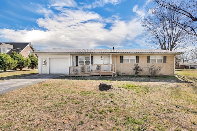 ranch-style home with brick siding, an attached garage, a front yard, crawl space, and driveway