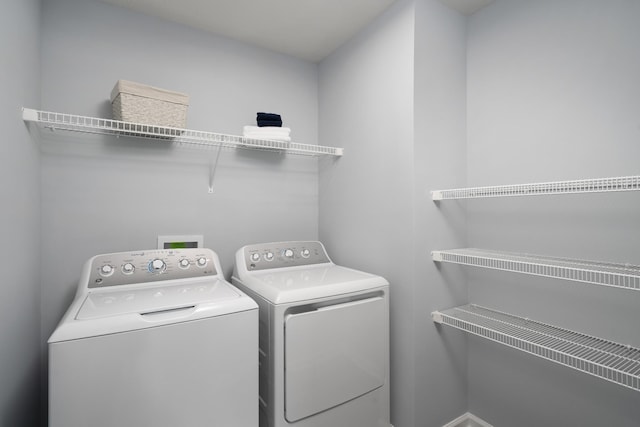 laundry room featuring laundry area and washer and clothes dryer