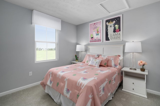 bedroom with baseboards, a textured ceiling, attic access, and light colored carpet