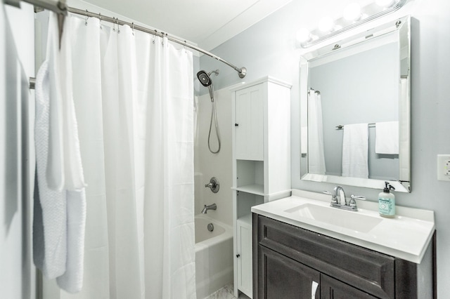 bathroom featuring shower / bath combo and vanity