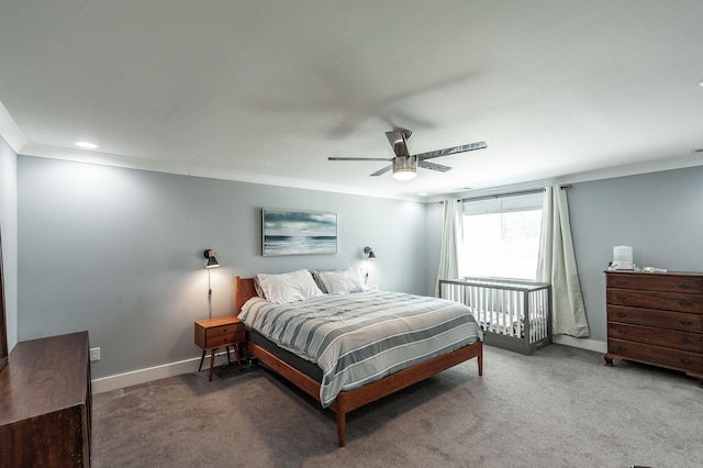 bedroom featuring carpet flooring, ornamental molding, baseboards, and ceiling fan