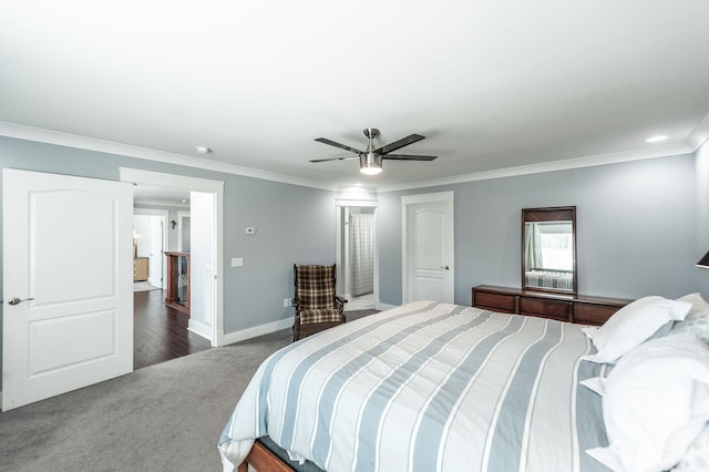 bedroom with baseboards, a ceiling fan, dark carpet, and crown molding
