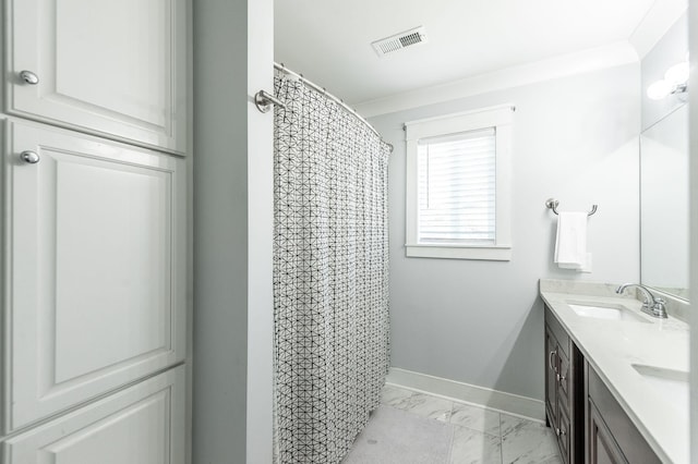 bathroom featuring a sink, marble finish floor, baseboards, visible vents, and double vanity