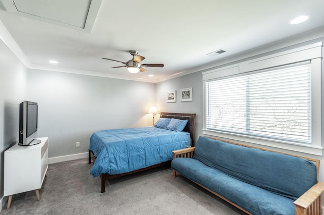 carpeted bedroom featuring baseboards, ornamental molding, visible vents, and attic access