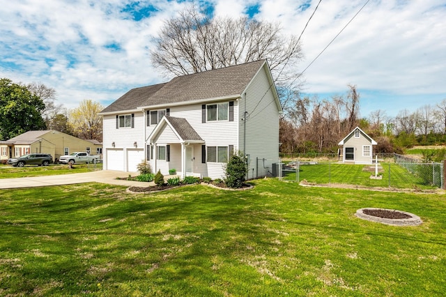 view of front of property with fence, driveway, central AC, a front lawn, and a garage