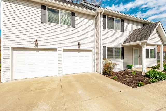 view of front of home featuring concrete driveway and a garage