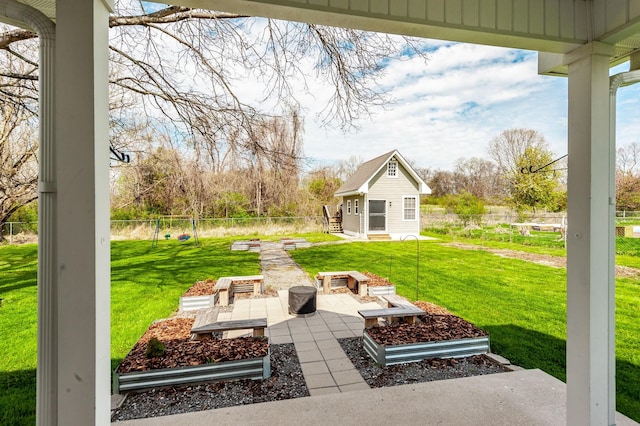 view of patio featuring an outbuilding and fence private yard