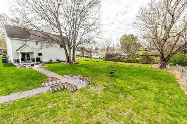 view of yard with a fenced backyard, central AC, and a patio area
