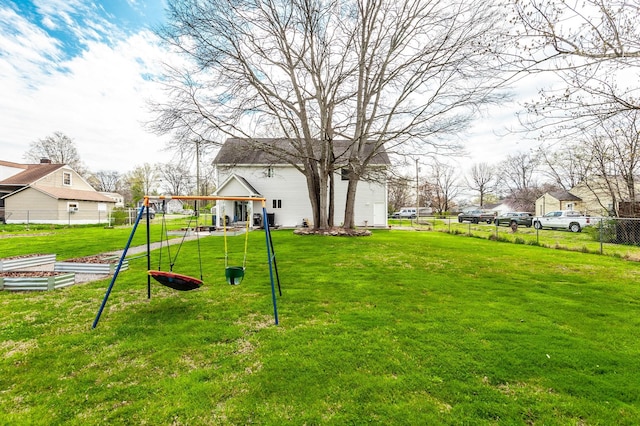 view of yard featuring fence and a playground