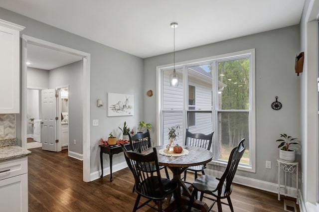 dining area with visible vents, dark wood finished floors, and baseboards