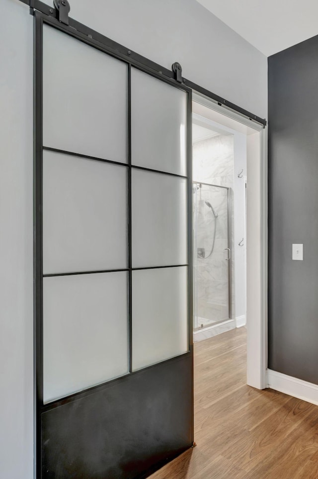 bathroom featuring baseboards and wood finished floors