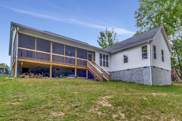 rear view of house with stairs, a yard, crawl space, and a sunroom