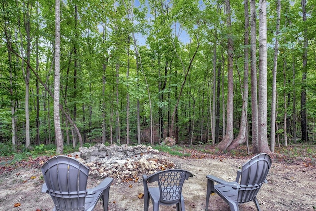 view of patio / terrace featuring a forest view