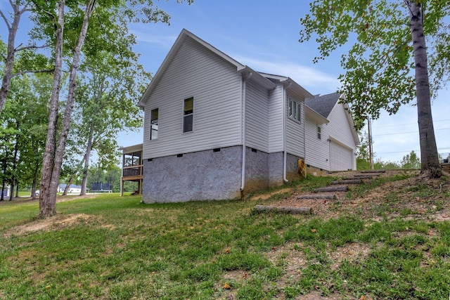 view of home's exterior with crawl space and a yard