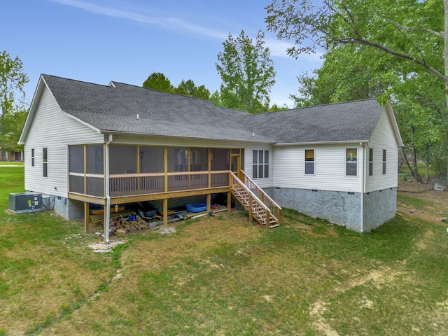 back of property with central air condition unit, a sunroom, a yard, stairway, and crawl space