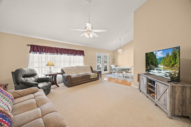 living area featuring high vaulted ceiling, carpet, a ceiling fan, and baseboards