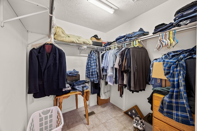 walk in closet featuring light tile patterned floors