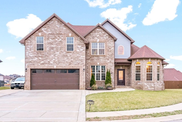 view of front of property featuring driveway, an attached garage, a front lawn, and brick siding