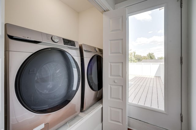 washroom with laundry area and separate washer and dryer