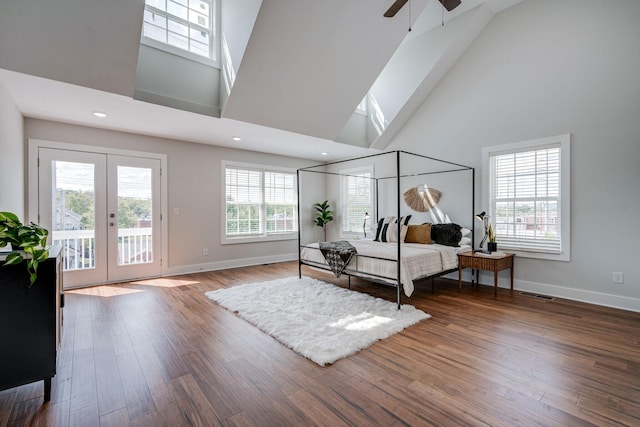 bedroom with access to outside, baseboards, wood finished floors, and french doors